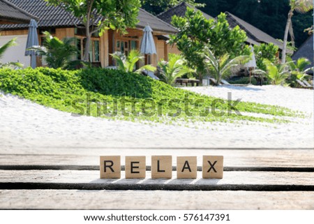 RELAX text on the beach Concept.