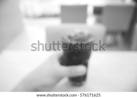Picture blurred  for background abstract and can be illustration to article of hand hold cola glass