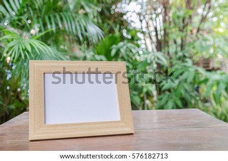 Picture frame on the background of trees. select focus