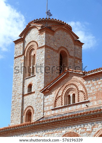 Vertical picture of beautiful tower of Saint Clement Church under vibrant blue sky, Ohrid, Macedonia