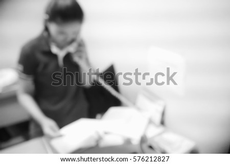 Picture blurred  for background abstract and can be illustration to article of businesswoman talking on telephone in office