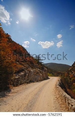 Mountain Landscape,  Sun in the Blue Sky and Road. Crimea. Ukraine. Europe.
