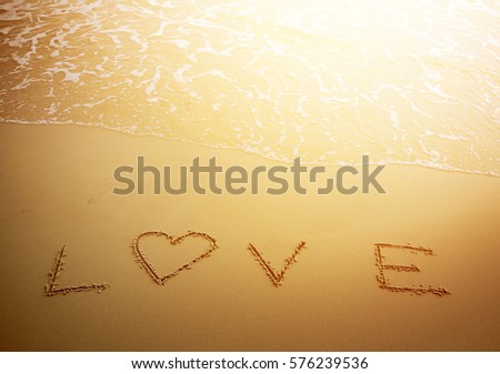 Valentines Day background, word love on the beach