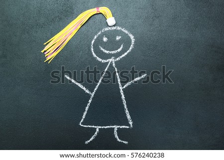 Painted girl with yellow braid on a blackboard