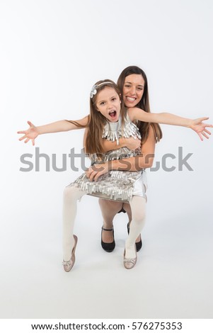 beautiful bright picture of hugging mother and daughter  isolated on white background