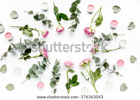 Floral pattern made of pink roses, green leaves eucalyptus, branches on white background. Flat lay, top view. Valentine's background. Floral pattern. Pattern of flowers. Flowers pattern texture