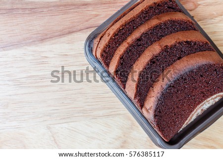 cake in dish and spoon fork on a wooden background