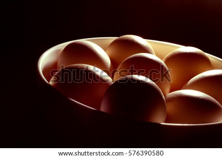 Egg background / Eggs are laid by female animals of many different species, including birds, reptiles, amphibians, mammals, and fish, and have been eaten by humans for thousands of years