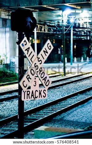 Railroad Crossing Sign at Night