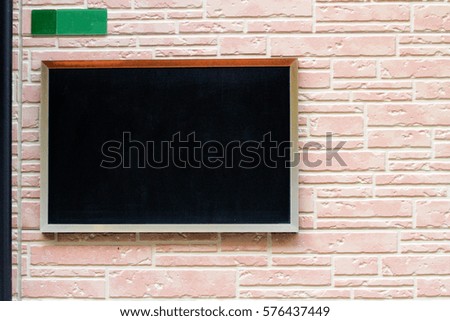 Signs Blackboard on tile wall background