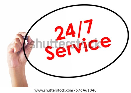 Businessman writing 24/7 Service word with pen.