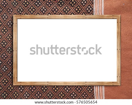 wooden frame poster mockup on abstract pattern textile background