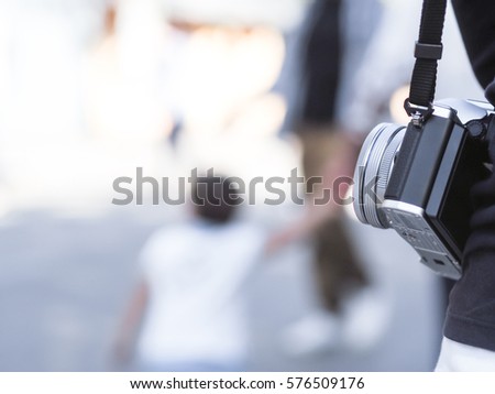 Camera with woman on travel with blur background