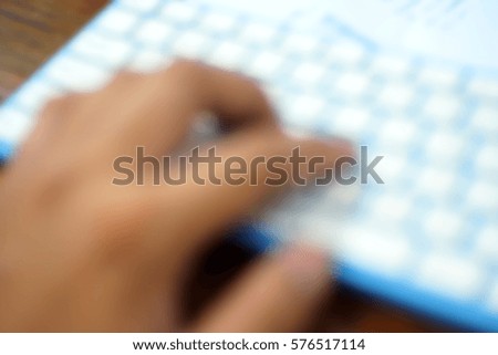 Blurred  background abstract and can be illustration to article of hand typing on keyboard