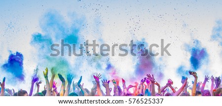 colored powder fired up,human hands,good fun. Royalty-Free Stock Photo #576525337