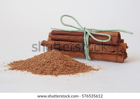 Cinnamon sticks and powder on white background. baking spices