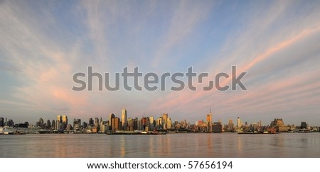 Panoramic view of Midtown Manhattan skyline with dramatic cloud formations