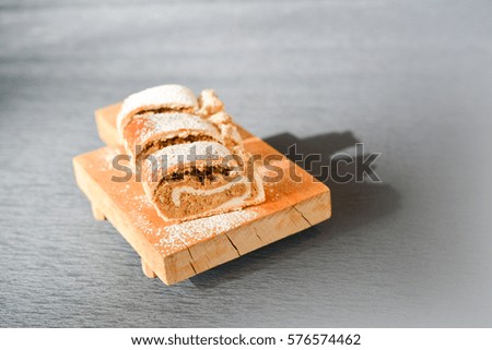 Walnuts strudel on wooden plate