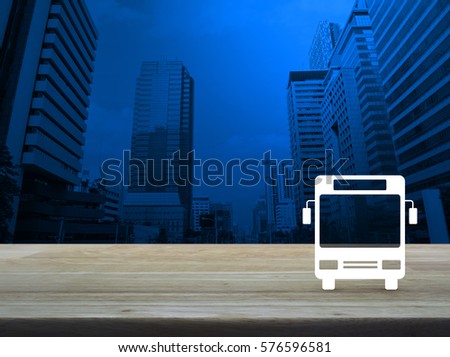 Bus flat icon on wooden table over modern office city tower, Business transportation service concept