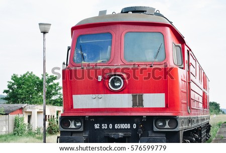 Old red train, in the station, natural background, green and red, Romania