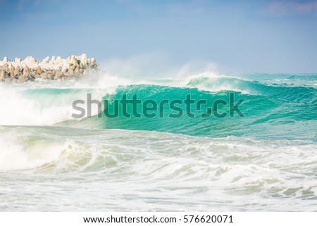Waves in ocean and stones. Turquoise Water