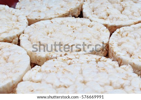 Stack of puffed whole grain crispbread. Rice cake puffed rice texture.Round rice cakes background. Corn crackers. Rice galettes Studio photo texture photography.