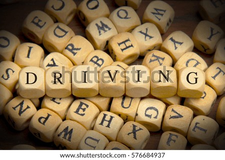 Driving word written on wood block
