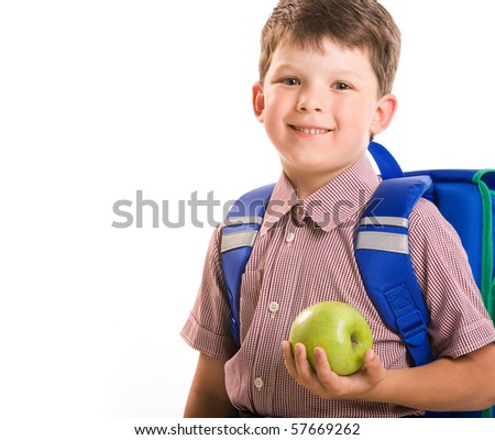 Portrait of handsome boy with a green apple isolated on a white background