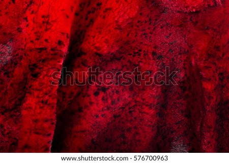 Texture, background. Mink fur. the short, fine, soft hair of certain animals. Painted in red