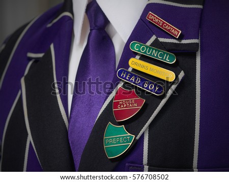 School boys blazer with school badges Royalty-Free Stock Photo #576708502
