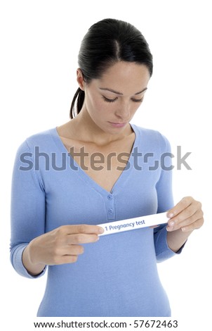 Woman reading instructions on pregnancy test