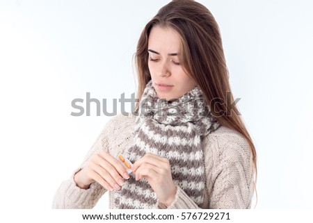 young girl with  scarf and warm sweater is isolated on  white background
