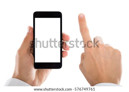 Close-up Of Man's Hand Holding Mobile Phone Against White Background