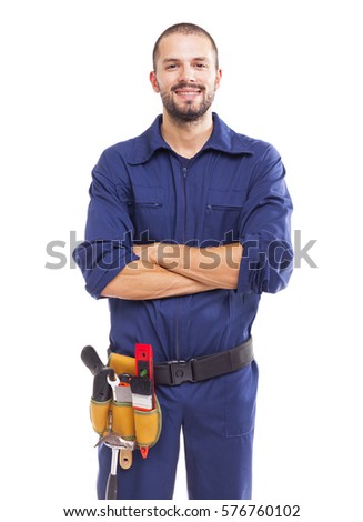 Portrait of a young worker smiling with arms crossed, isolated on white backround Royalty-Free Stock Photo #576760102