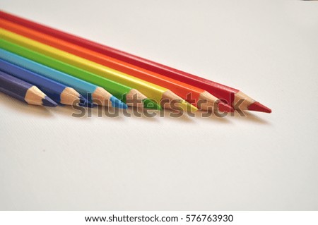 Seven colorful pencils
