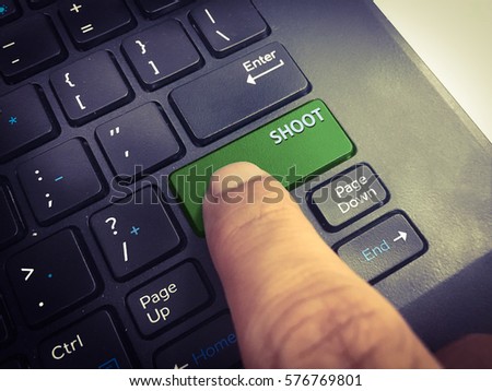 Close-up SHOOT button on the keyboard and have GREEN color button isolate black keyboard.