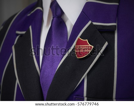 School boys blazer with red prefect school badge Royalty-Free Stock Photo #576779746