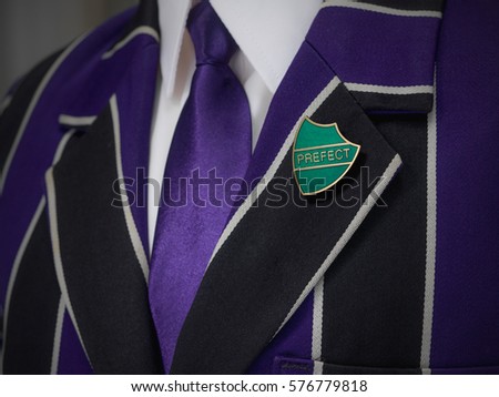 School boys blazer with green prefect school badge Royalty-Free Stock Photo #576779818
