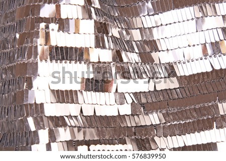 Mirror dress material cloth texture pattern. 

tailoring stitching concept. Shiny mirrored fashion fabric.
