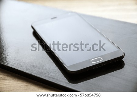 Mobile phone on a black background