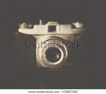 Vintage photo camera in sepia tone