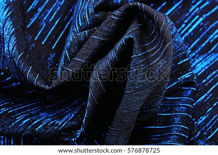 Mirror dress material cloth texture pattern. 

tailoring stitching concept. Shiny mirrored fashion fabric. Shiny clothing material sample.Creased fabric.