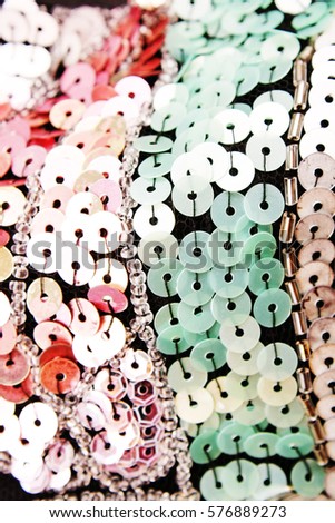 Mirror spangle dress material cloth texture pattern. tailoring stitching concept. Shiny mirrored fashion fabric. Shiny clothing material sample.Creased spangle pailette fabric.