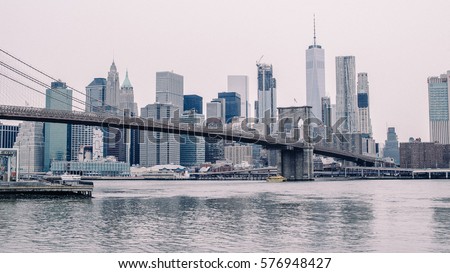 Closeup Shot of Brooklyn Bridge in New York with Skyline in Background