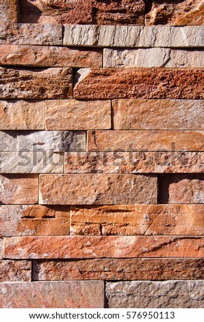 Wall of red bricks and rectangular stones.
 Royalty-Free Stock Photo #576950113