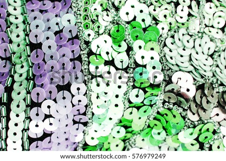 Mirror dress material cloth texture pattern. 

tailoring stitching concept. Shiny mirrored fashion fabric. Shiny clothing material sample.Creased fabric. 
Sequin spangle texture.