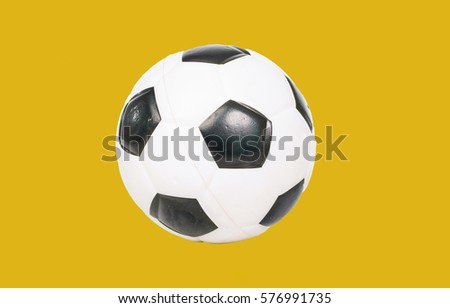 Football ball white and black soccer ball in isolated background. Soccerball Realistic soccer ball isolated on white background with clipping path. Ball sport game.  Yellow isolated background.