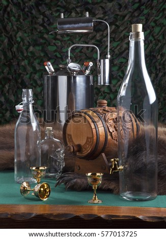 Manufacture of wine, vodka. still life with a picture of glass bottles, a keg on a background of the slain bear skins.