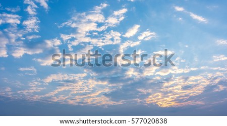 Panorama of Morning Sunrise with a perfect blue but cloudy sky. 