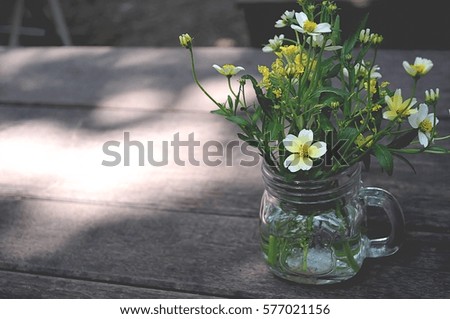 Flower little in vase so beautiful on wood table